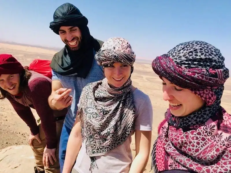 Family in Berber turbans in the desert
