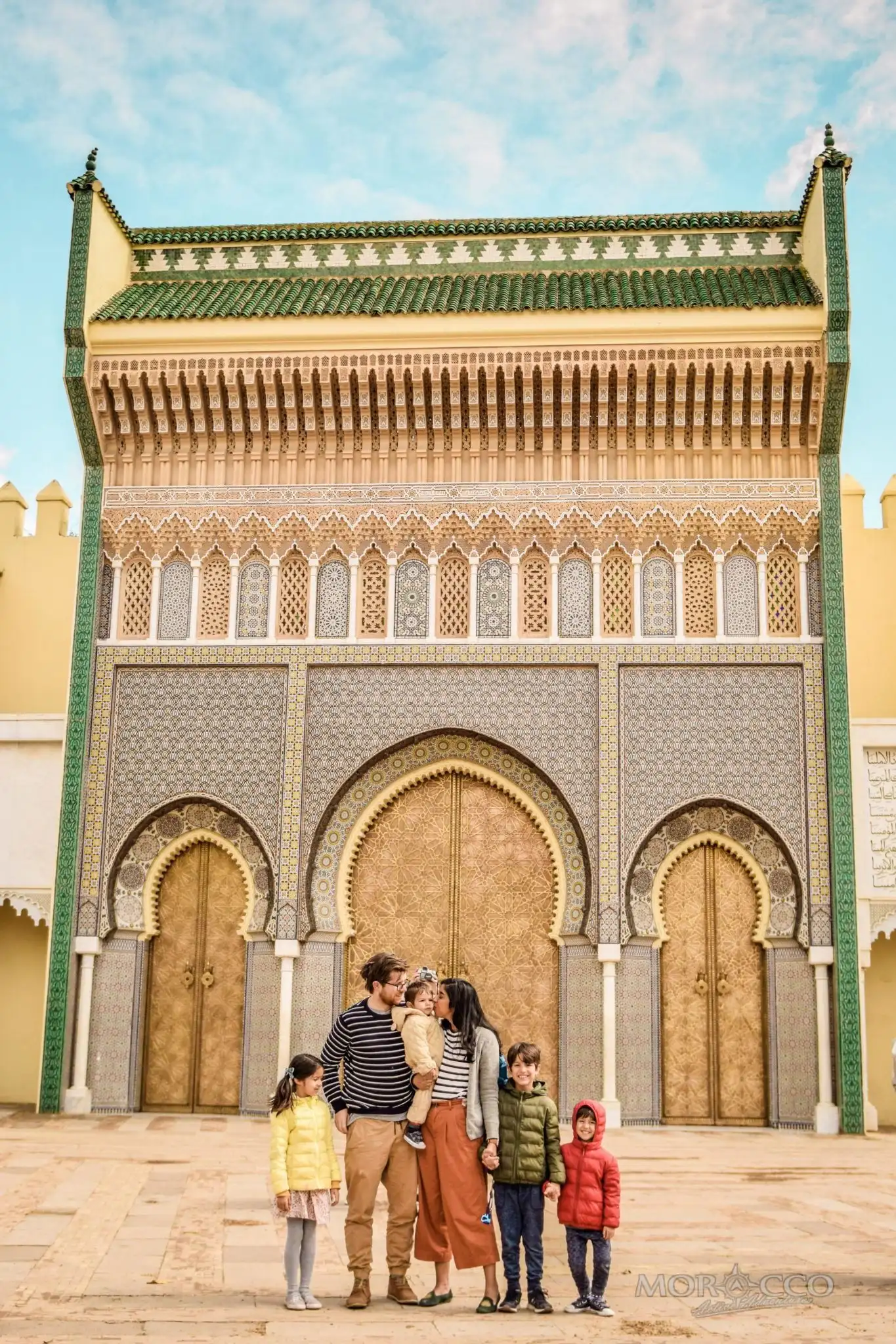 9 days Morocco highlights: A family in front of the golden doors of the Royal Palace in Fes